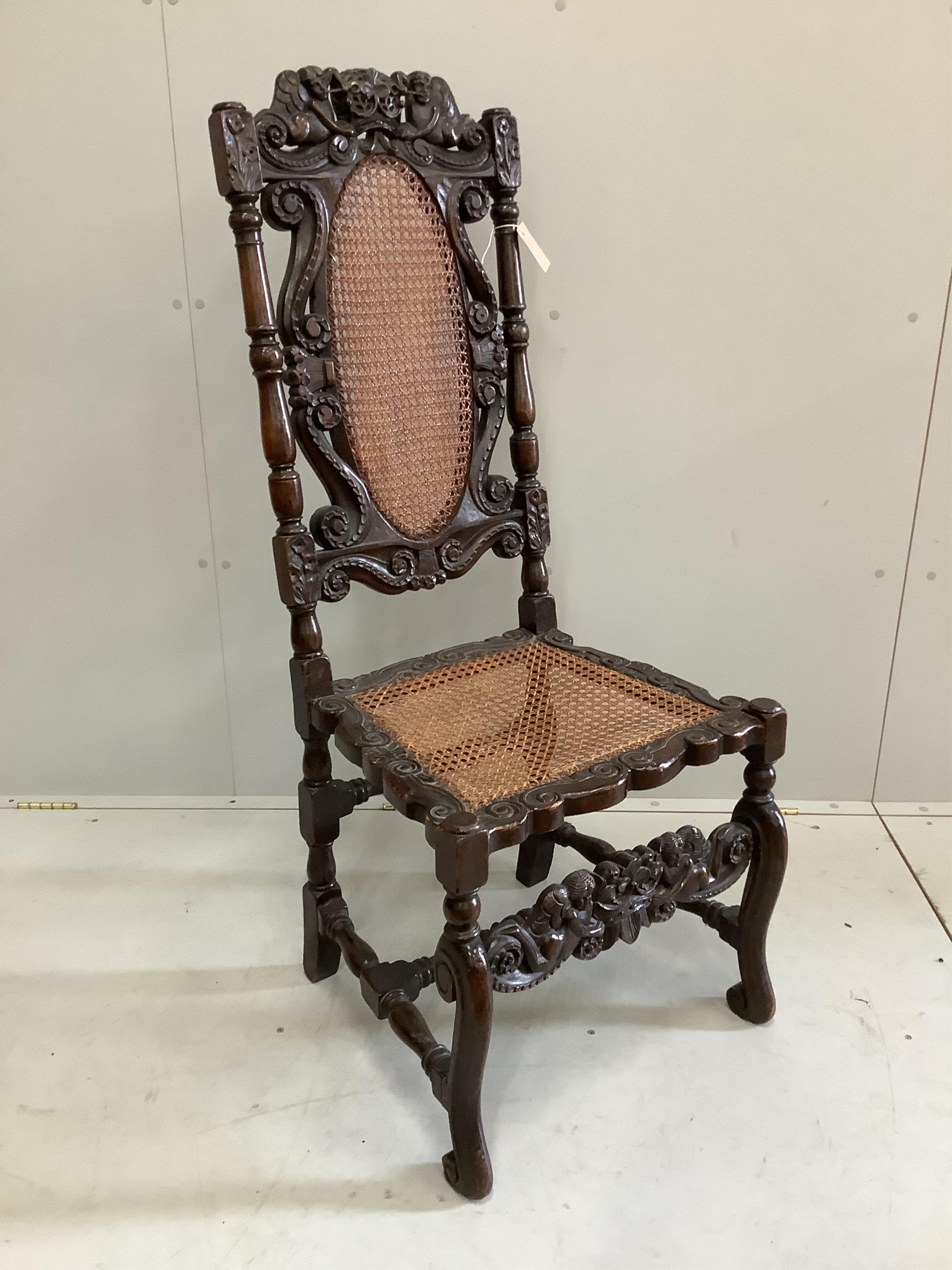 A Charles II carved walnut caned seat and back dining chair, height 124cm. Condition - fair